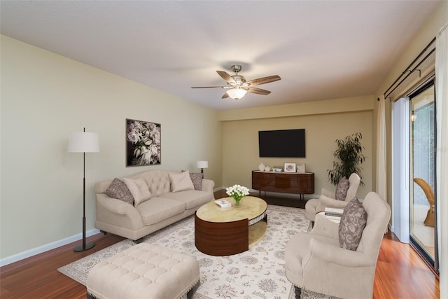 living room with ceiling fan and hardwood / wood-style floors