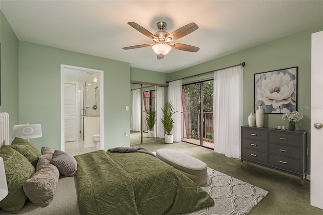 carpeted bedroom featuring access to outside, connected bathroom, ceiling fan, and a closet