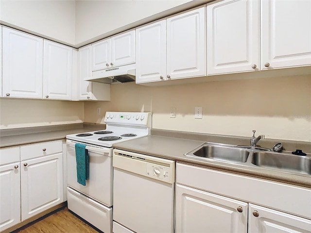 kitchen featuring white cabinets, white appliances, light hardwood / wood-style floors, and sink