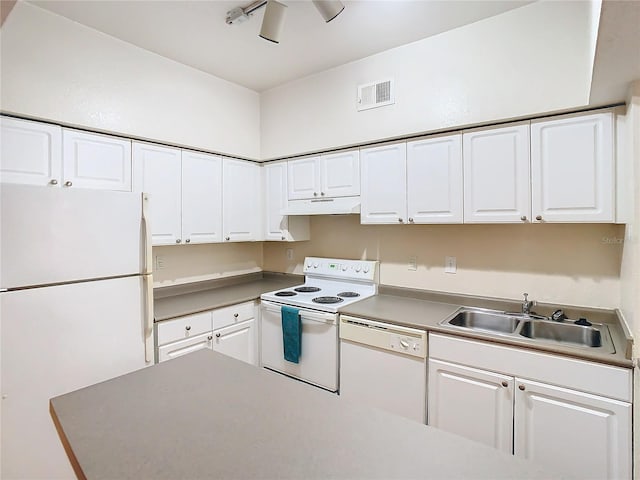 kitchen featuring white appliances, ceiling fan, white cabinetry, and sink