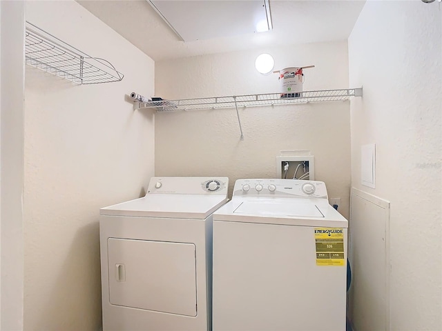 laundry room with washing machine and clothes dryer