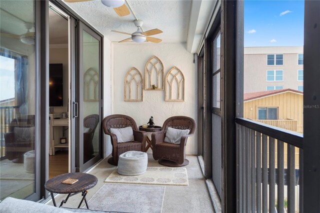 balcony featuring ceiling fan