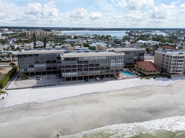 bird's eye view featuring a view of the beach and a water view