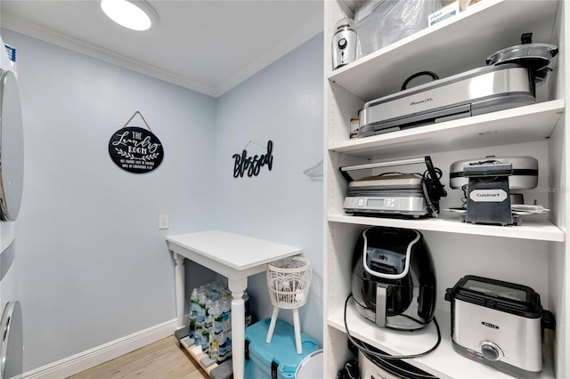 interior details with crown molding and hardwood / wood-style floors