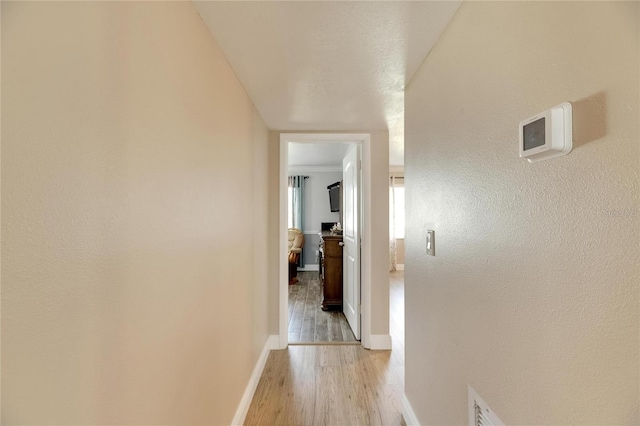 corridor featuring light hardwood / wood-style flooring