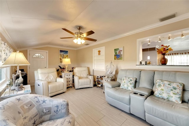 living room featuring ceiling fan, lofted ceiling, plenty of natural light, and ornamental molding