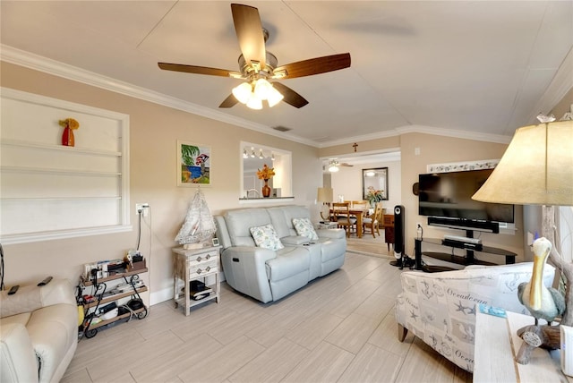 living room with lofted ceiling, ceiling fan, and crown molding