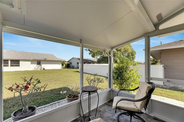 sunroom / solarium with lofted ceiling and plenty of natural light