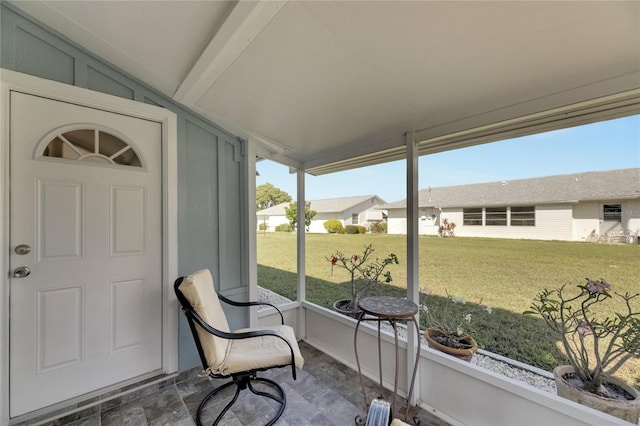 sunroom / solarium with vaulted ceiling