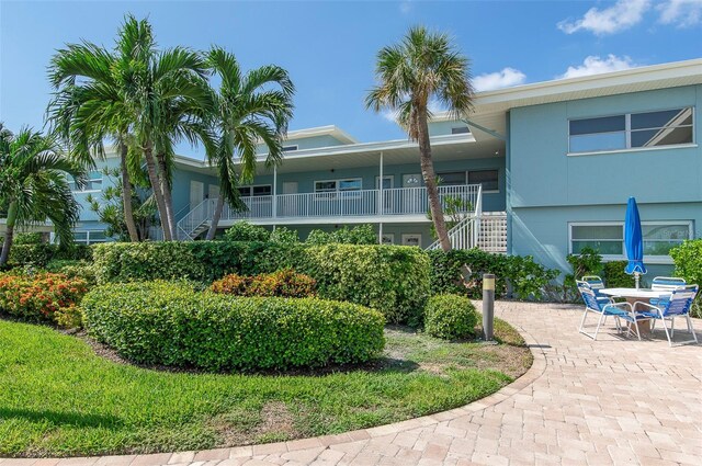 6000 2nd St E Unit 6, St Pete Beach, FL 33706 - view of property with stairway