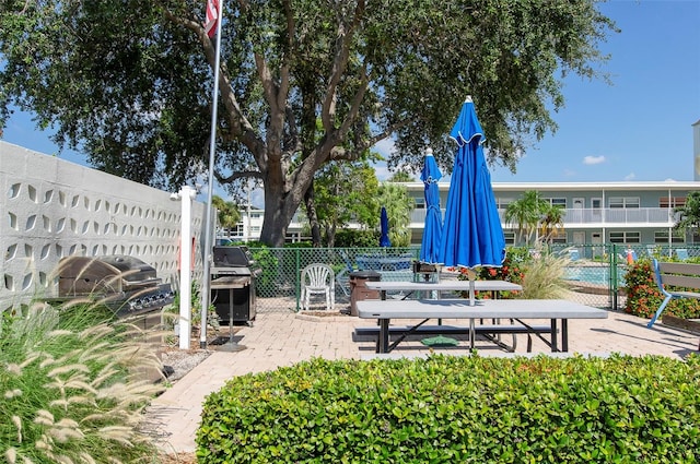 surrounding community featuring a patio