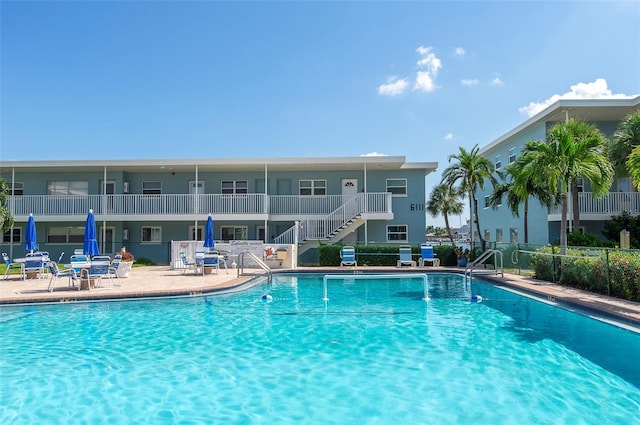 view of swimming pool with a patio area