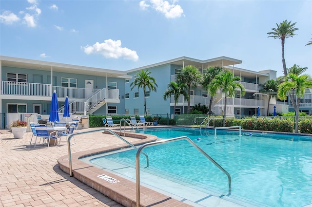 view of swimming pool featuring a patio area