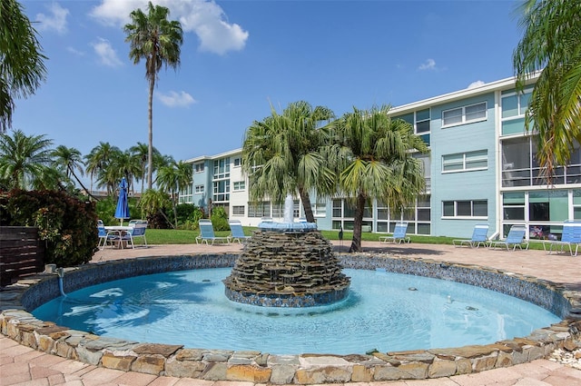 view of swimming pool with a patio area