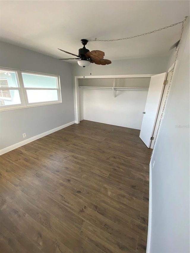 6000 2nd St E Unit 6, St Pete Beach, FL 33706 - unfurnished bedroom featuring dark wood-type flooring, ceiling fan, and a closet
