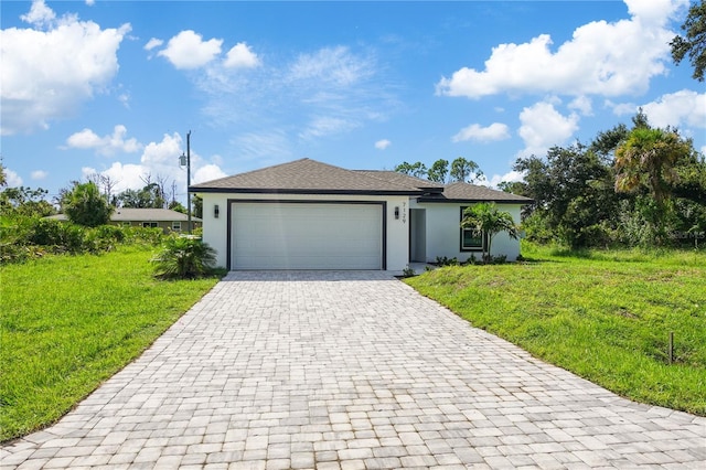 view of front facade with a front lawn and a garage