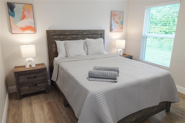 bedroom featuring dark hardwood / wood-style floors