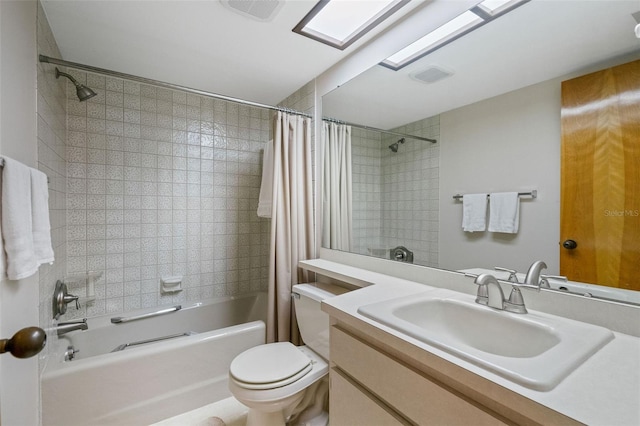 full bathroom with vanity, toilet, and shower / bath combo