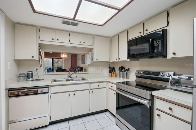 kitchen with white cabinets, white dishwasher, light tile patterned floors, sink, and stainless steel electric range