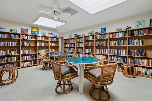 living area featuring ceiling fan