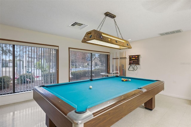 rec room featuring pool table and a textured ceiling