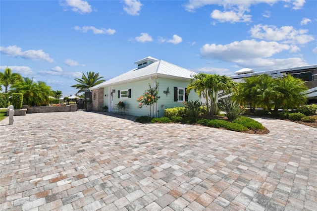 view of side of property with a patio area