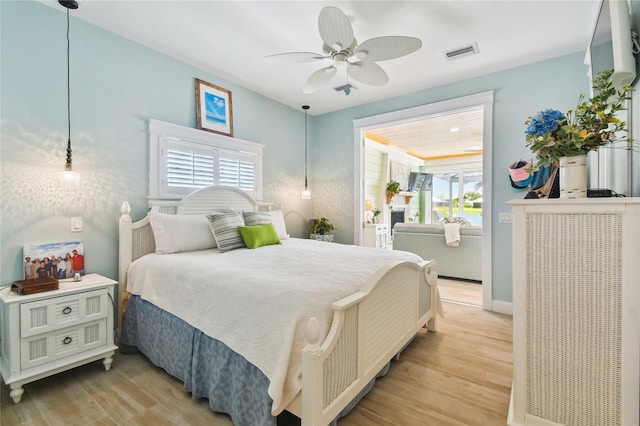 bedroom with light wood-type flooring and ceiling fan