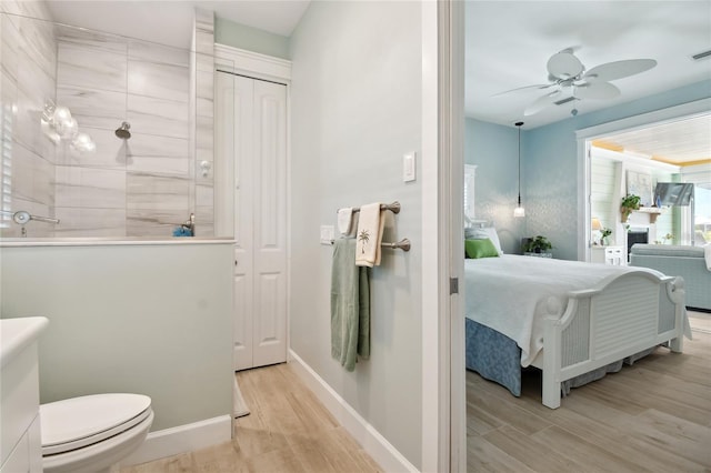 interior space with ceiling fan, a closet, and light hardwood / wood-style flooring