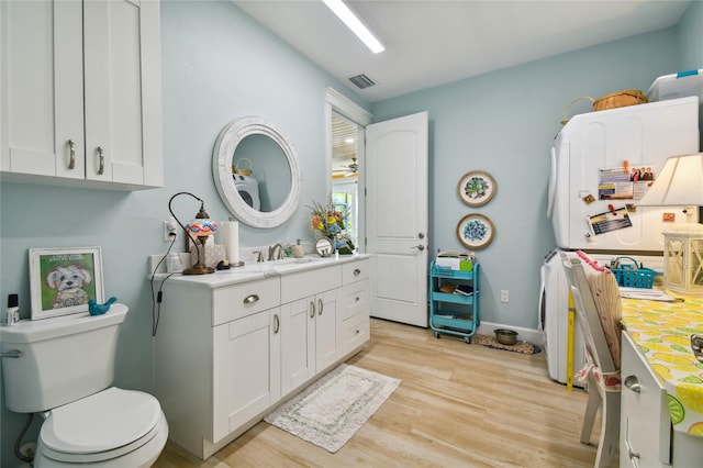 bathroom featuring hardwood / wood-style flooring, vanity, and toilet