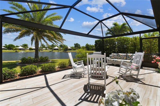 exterior space featuring a water view, a lanai, and a patio area