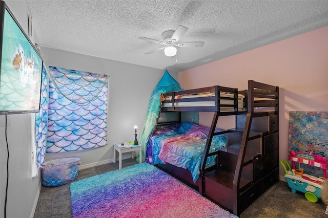 bedroom featuring ceiling fan, carpet floors, and a textured ceiling