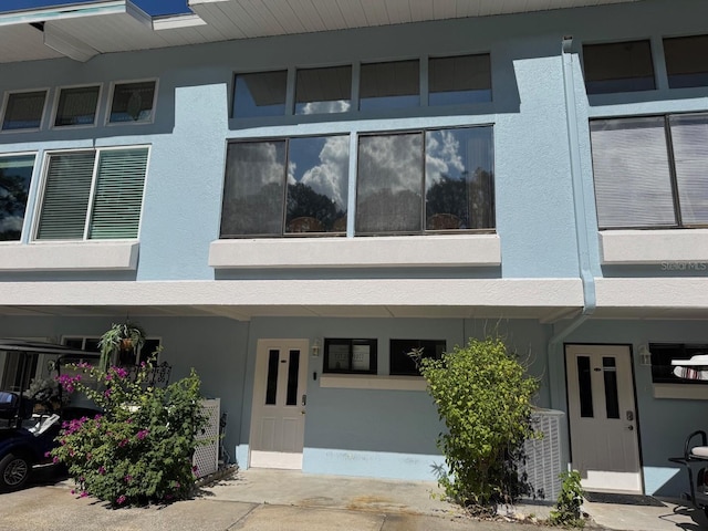 1873 Mazo Mnr Unit T2, Lutz, FL 33558 - view of building exterior with central air condition unit