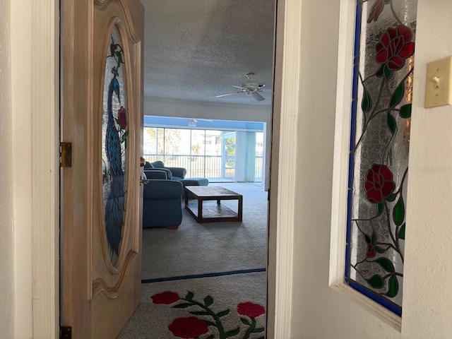 1873 Mazo Mnr Unit T2, Lutz, FL 33558 - corridor featuring carpet floors and a textured ceiling