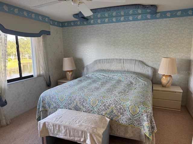 1873 Mazo Mnr Unit T2, Lutz, FL 33558 - carpeted bedroom featuring wallpapered walls and ceiling fan