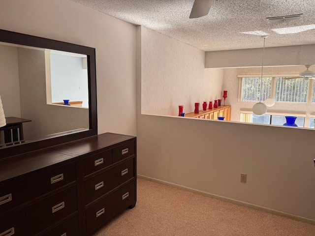 1873 Mazo Mnr Unit T2, Lutz, FL 33558 - bedroom with light carpet and a textured ceiling
