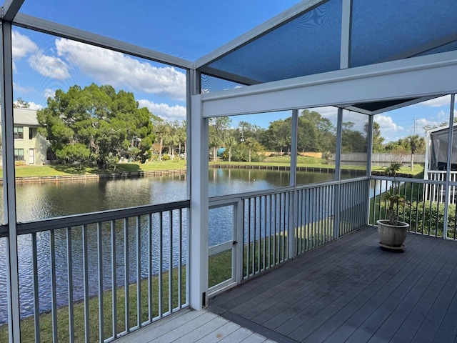 1873 Mazo Mnr Unit T2, Lutz, FL 33558 - unfurnished sunroom featuring a water view, view of wooded area, and plenty of natural light