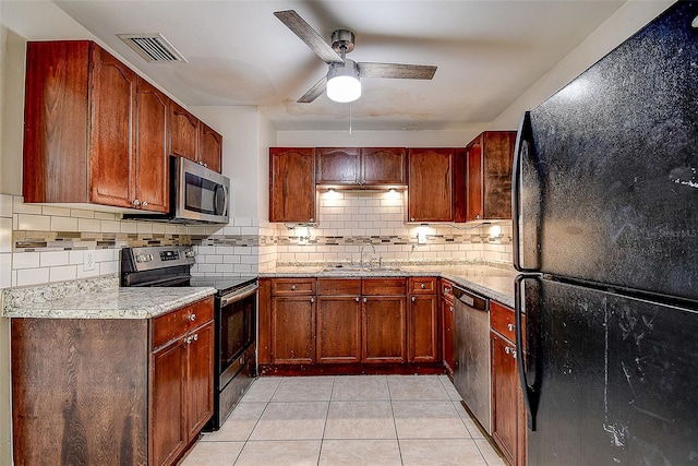 kitchen with light tile patterned flooring, sink, black appliances, backsplash, and ceiling fan