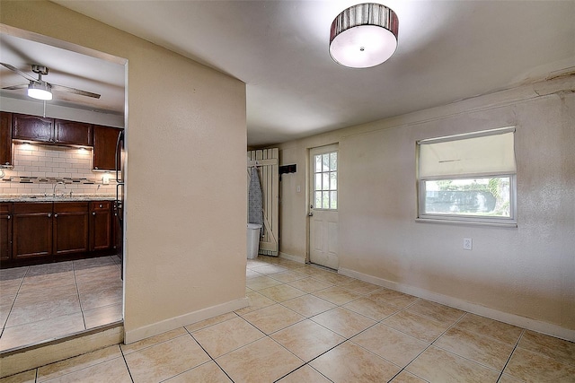 interior space with sink and ceiling fan