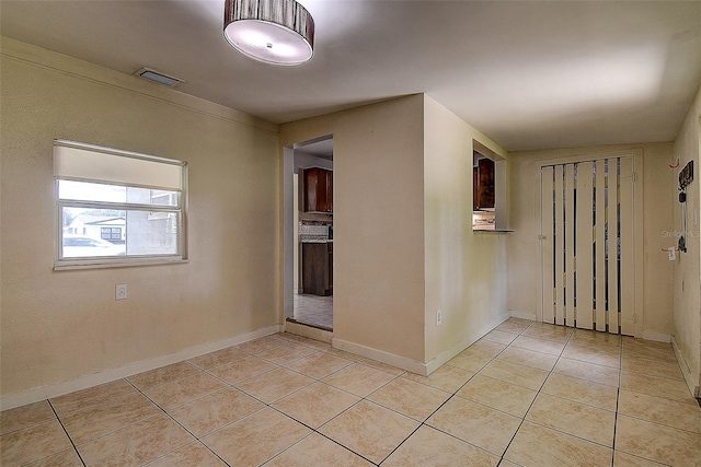 foyer entrance featuring light tile patterned floors