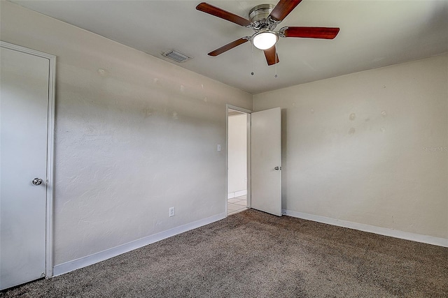 carpeted empty room with ceiling fan