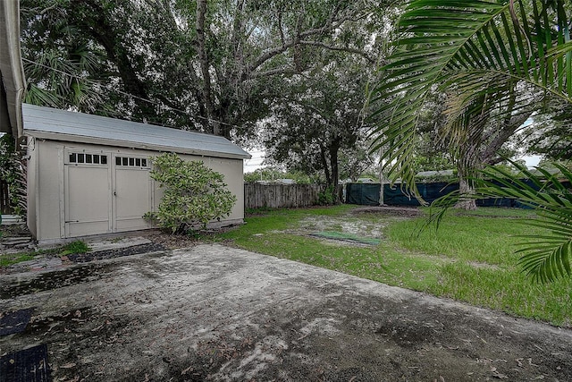 view of yard with a patio and an outdoor structure