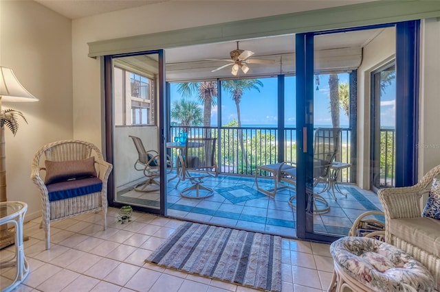 sunroom / solarium featuring ceiling fan and plenty of natural light