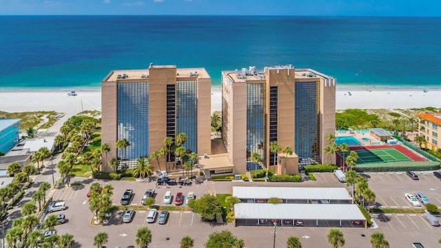 aerial view featuring a water view and a view of the beach