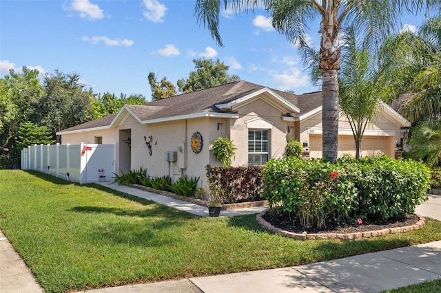 ranch-style home with a front yard and a garage