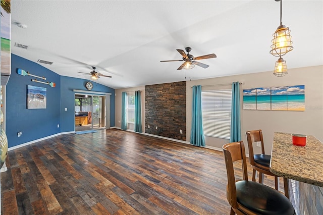 living room featuring wood-type flooring, lofted ceiling, and ceiling fan