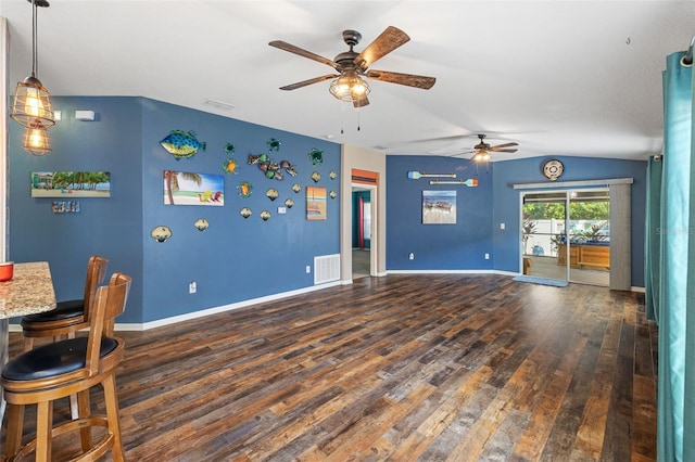 interior space with lofted ceiling, dark hardwood / wood-style floors, and ceiling fan