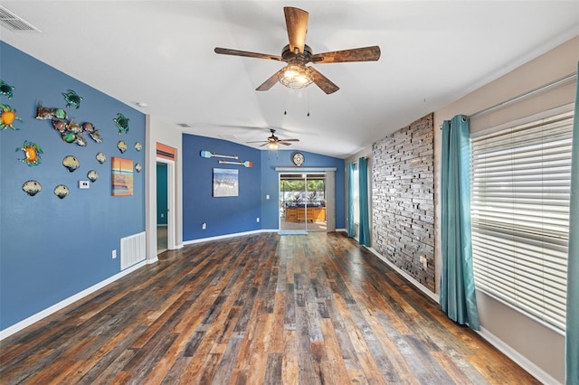 unfurnished living room featuring lofted ceiling, ceiling fan, and dark hardwood / wood-style floors