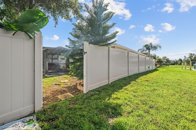 view of yard with a sunroom