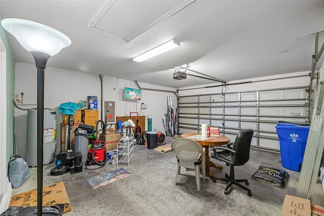 garage featuring a garage door opener, electric panel, and electric water heater