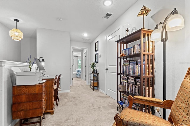 interior space featuring light colored carpet